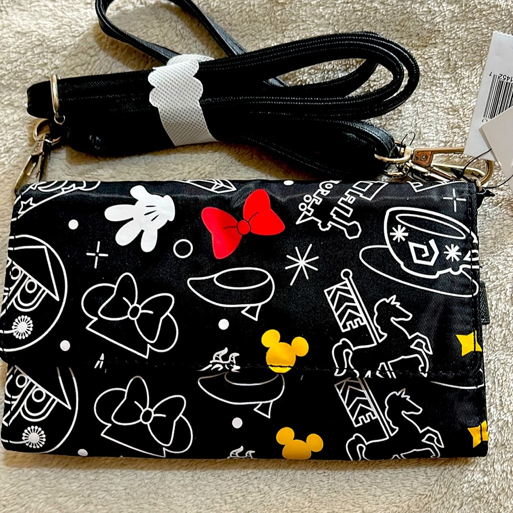 Disney wristlet or can be used as Crossbody snap closure.